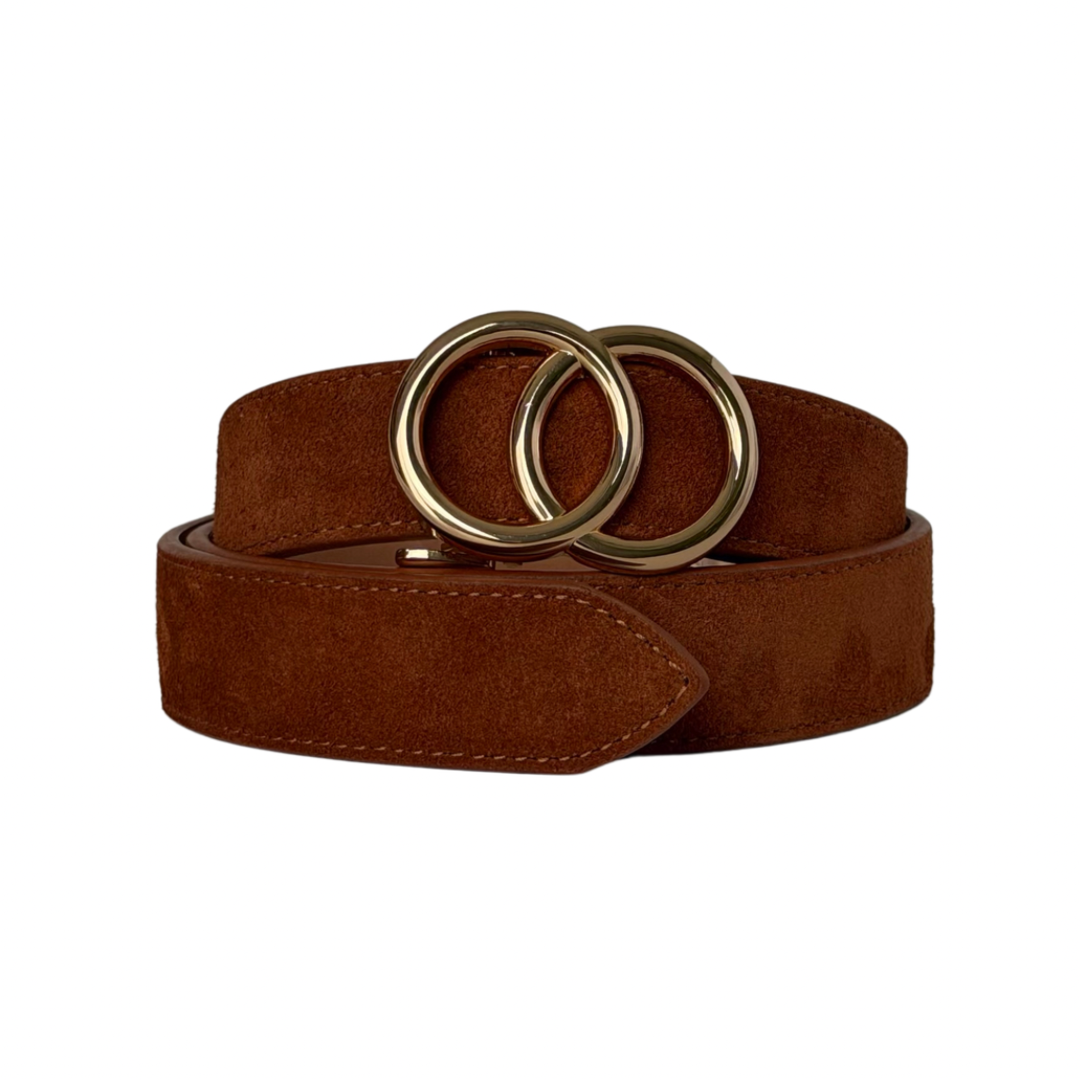 A brown suede belt with a double interlocking gold-tone metal ring buckle, coiled on a plain white background.
