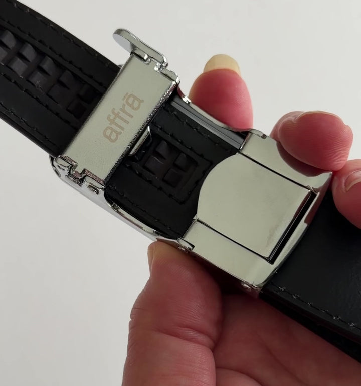 Affrā micro-adjustable belt demonstrating ratchet track system and adjustment